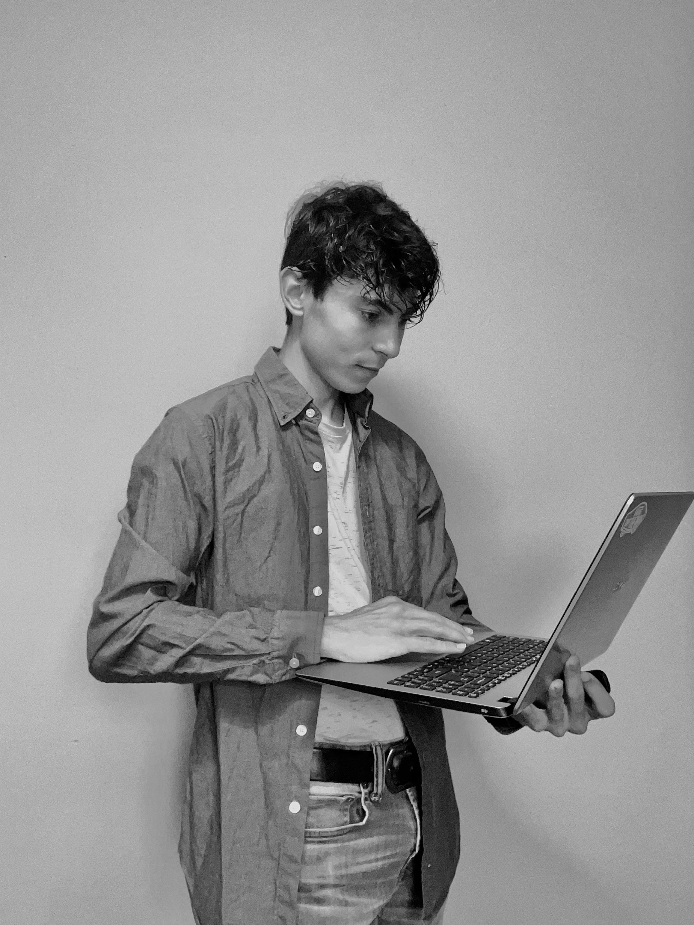 Gavin Holding Laptop Headshot Photo